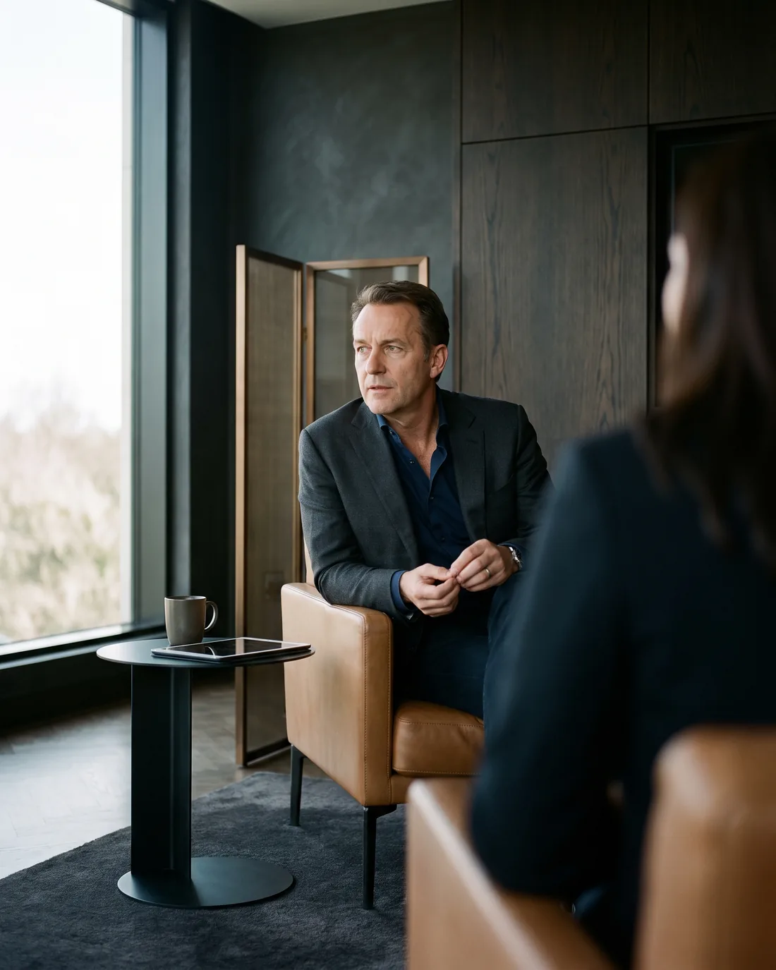A senior CHRO reviewing the work in a calm San Francisco boardroom
